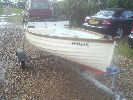 Finagle - An immaculate 11ft open boat with a fitted cover, oars, rowlocks, custom trailer, modern 4 stroke engine etc.